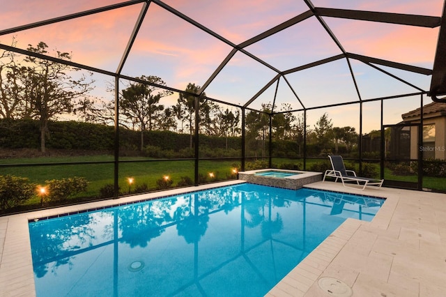 pool at dusk with a patio area and glass enclosure