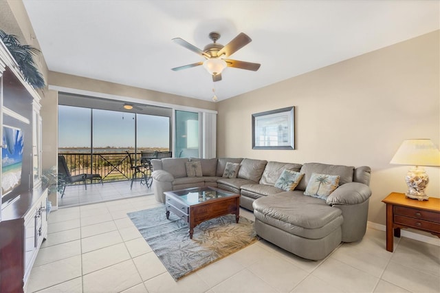 tiled living room featuring a ceiling fan