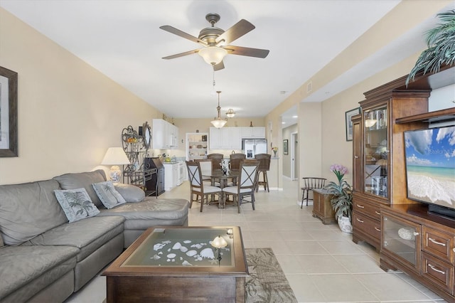 living room with light tile patterned floors and a ceiling fan