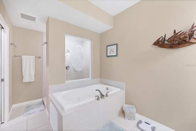 full bathroom featuring tile patterned floors, a walk in shower, and visible vents