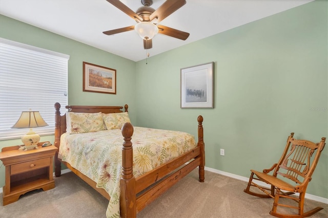 bedroom featuring a ceiling fan, carpet, and baseboards