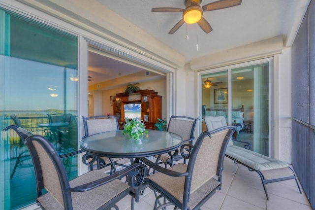 sunroom featuring ceiling fan