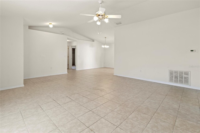 empty room featuring visible vents, ceiling fan with notable chandelier, baseboards, and lofted ceiling