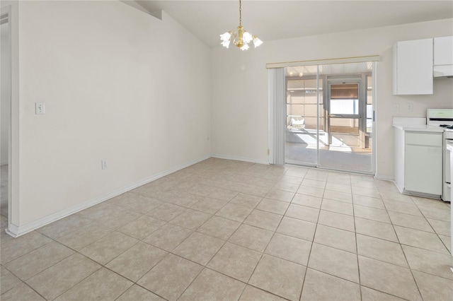 unfurnished dining area with light tile patterned floors, baseboards, a chandelier, and vaulted ceiling