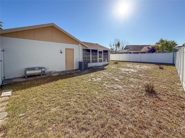 view of yard featuring central air condition unit and a fenced backyard