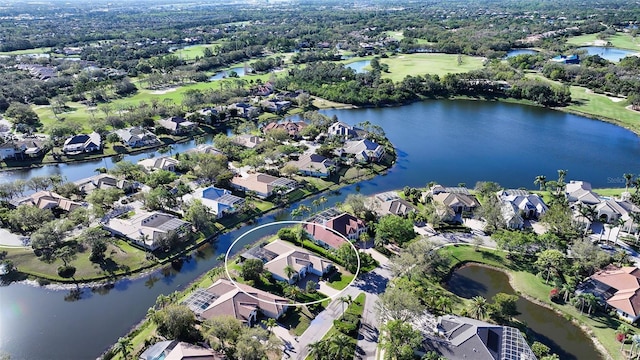 birds eye view of property with a residential view and a water view