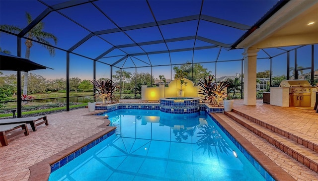 pool at dusk with glass enclosure, area for grilling, a pool with connected hot tub, a patio area, and a grill