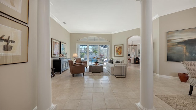 living room with visible vents, crown molding, baseboards, light tile patterned flooring, and ornate columns