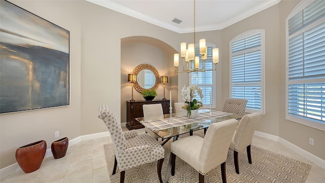 dining space with visible vents, baseboards, ornamental molding, light tile patterned floors, and a notable chandelier