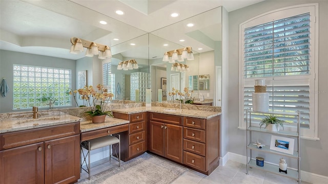 bathroom featuring vanity, tile patterned floors, recessed lighting, and baseboards