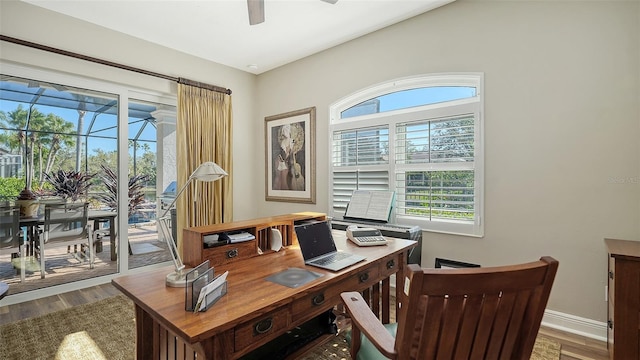 home office with wood finished floors, baseboards, and ceiling fan