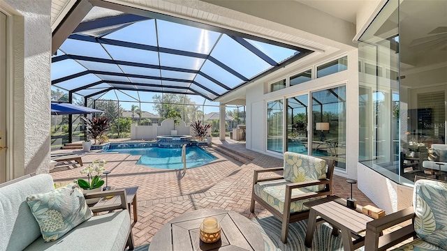 view of swimming pool with a lanai, an outdoor living space, a pool with connected hot tub, and a patio