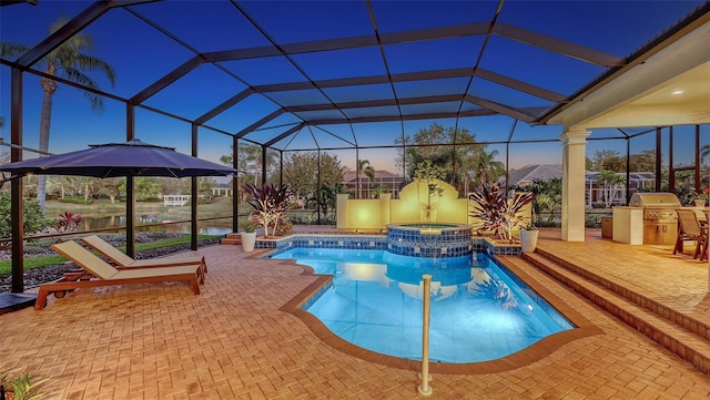 view of pool featuring glass enclosure, a pool with connected hot tub, area for grilling, and a patio area