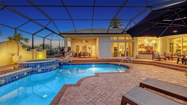 view of swimming pool with glass enclosure, a patio, outdoor dining space, and french doors