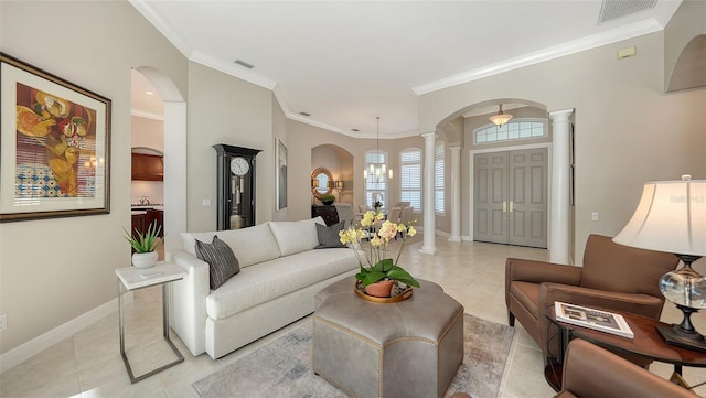 7340 Barclay Ct, University Park, FL 34201 - living area with ornate columns, light tile patterned floors, arched walkways, baseboards, and crown molding