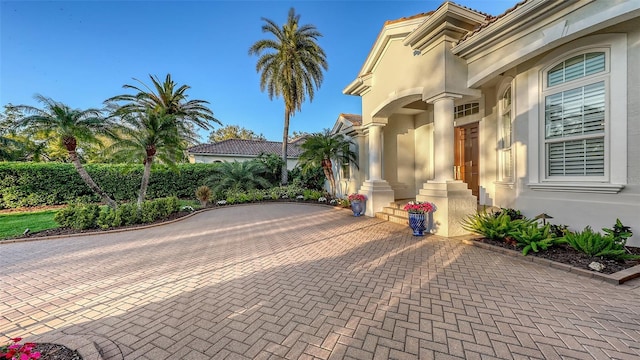 7340 Barclay Ct, University Park, FL 34201 - view of property exterior featuring stucco siding and a tiled roof