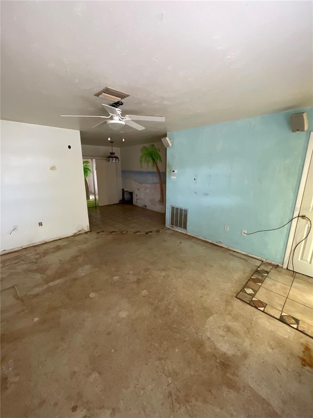 unfurnished living room with visible vents, concrete floors, and a ceiling fan