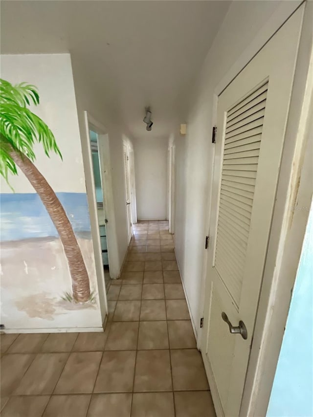 hallway with light tile patterned floors