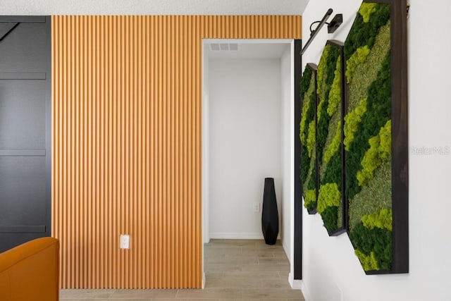 corridor with wood finish floors