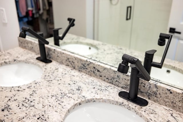 interior space with double vanity and a sink