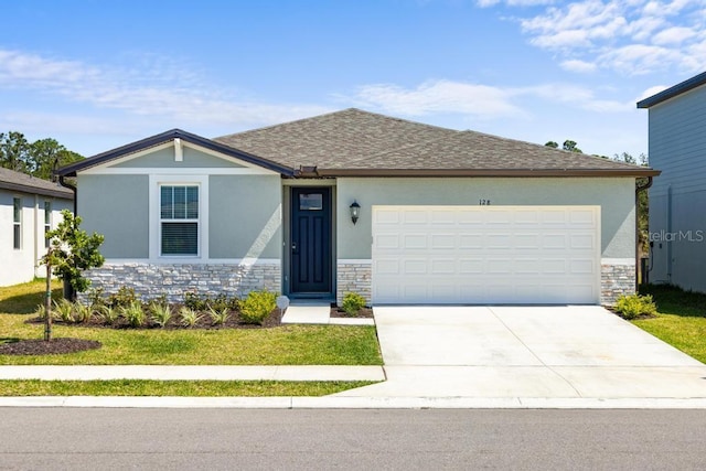 ranch-style house featuring stone siding, stucco siding, an attached garage, and concrete driveway