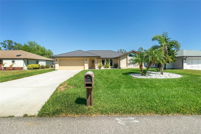 ranch-style house with stucco siding, a garage, metal roof, and a front yard