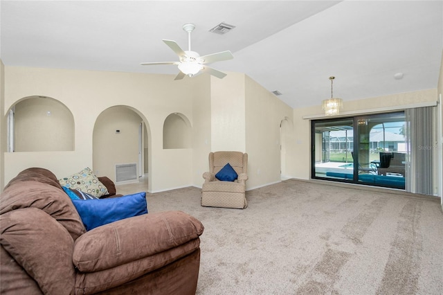 living room featuring a ceiling fan, vaulted ceiling, carpet, and visible vents