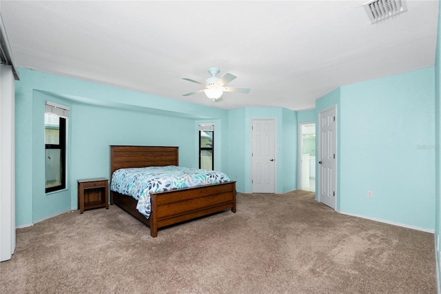 bedroom featuring visible vents, carpet floors, and ceiling fan