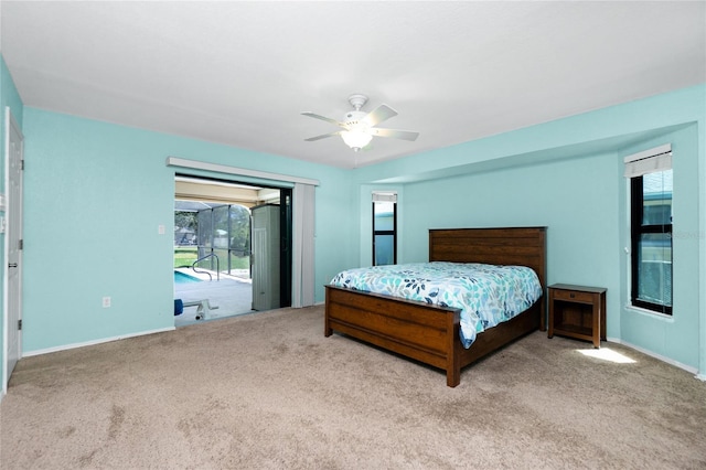 carpeted bedroom featuring access to exterior, baseboards, and ceiling fan