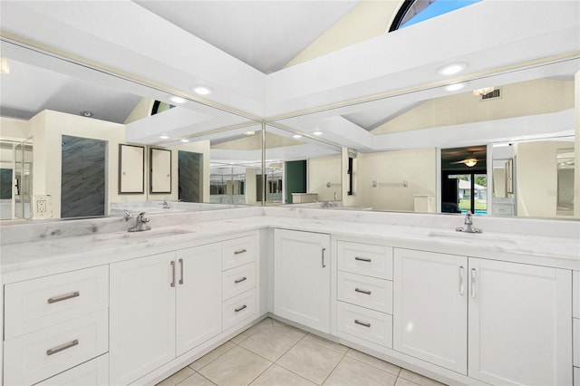 full bath featuring lofted ceiling, double vanity, and a sink