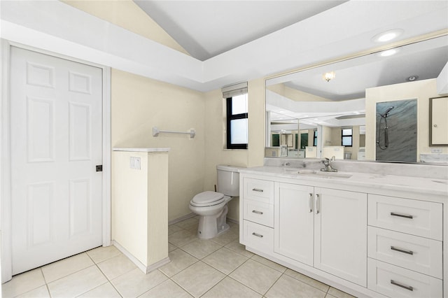 full bathroom with tile patterned flooring, baseboards, toilet, lofted ceiling, and vanity