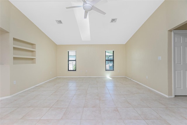 unfurnished room featuring built in shelves, a ceiling fan, visible vents, light tile patterned floors, and vaulted ceiling