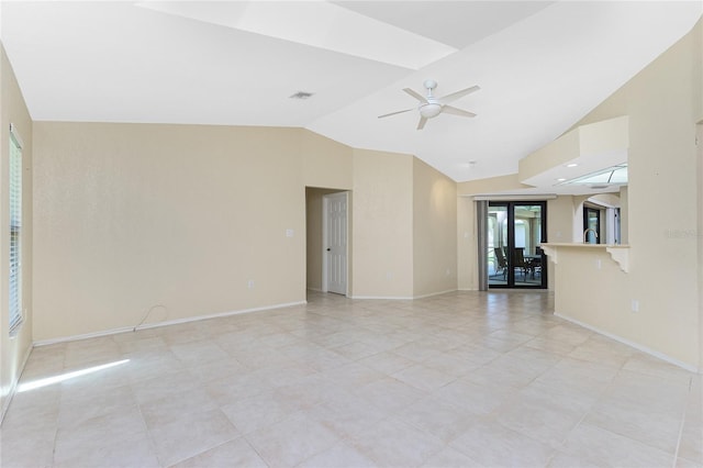 empty room featuring visible vents, lofted ceiling, baseboards, and ceiling fan