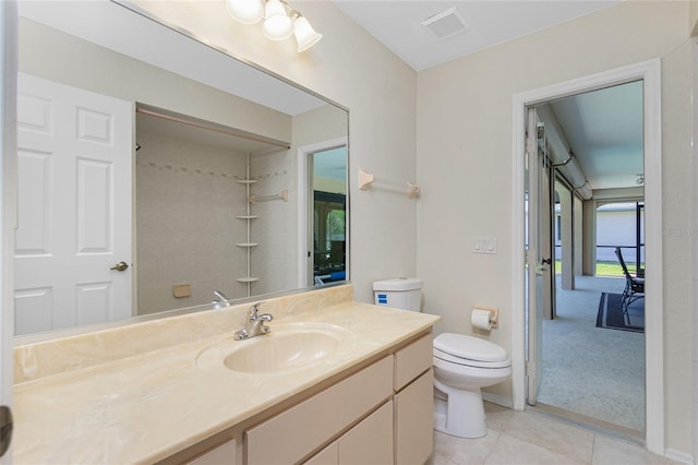 bathroom with tile patterned floors, visible vents, toilet, walk in shower, and vanity