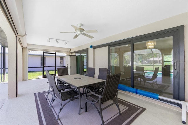 sunroom / solarium with plenty of natural light and a ceiling fan