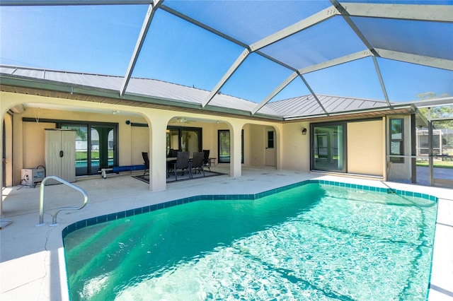 outdoor pool with outdoor dining area, a patio, and a lanai