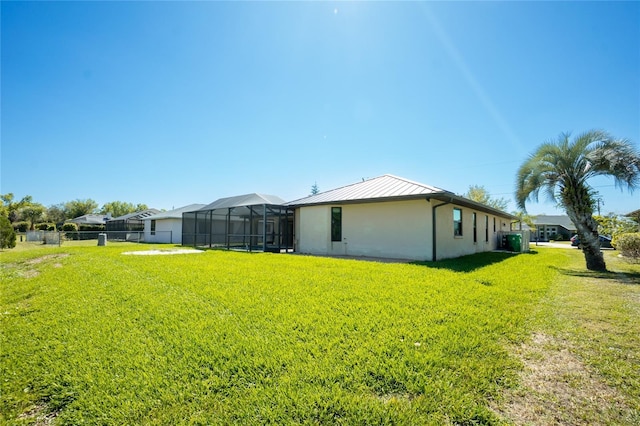 exterior space featuring glass enclosure and fence