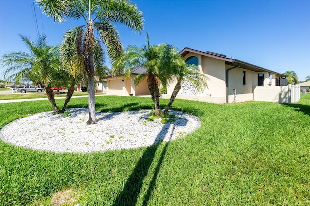 exterior space featuring an attached garage and fence