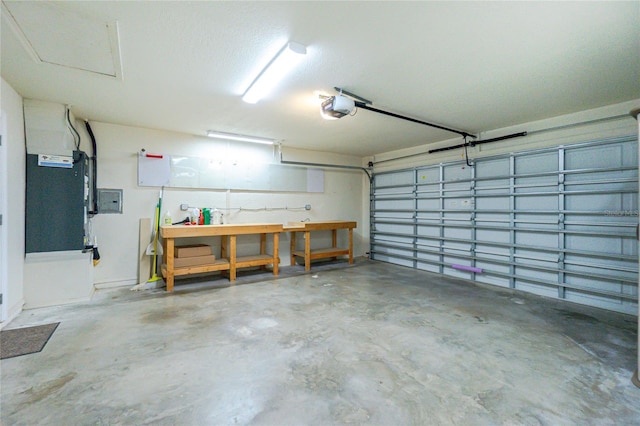 garage with electric panel and a garage door opener