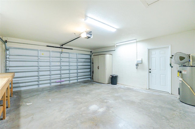 garage with water heater and a garage door opener