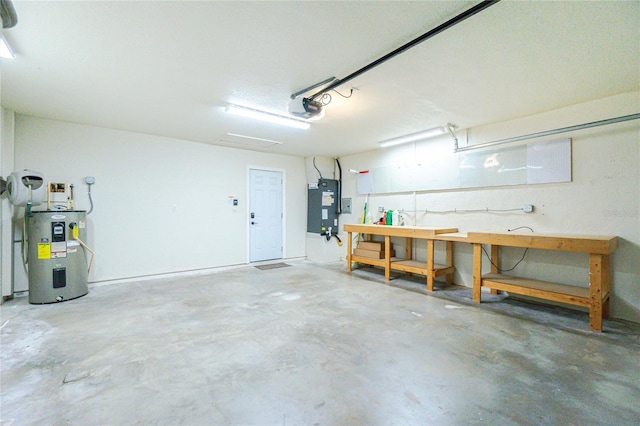 garage with a workshop area, electric water heater, and a garage door opener