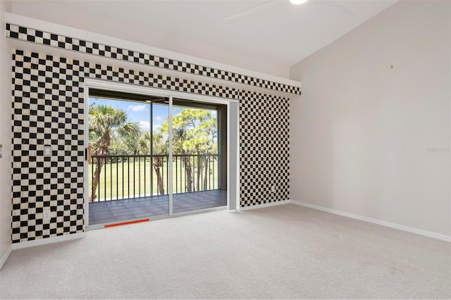 spare room with baseboards and carpet