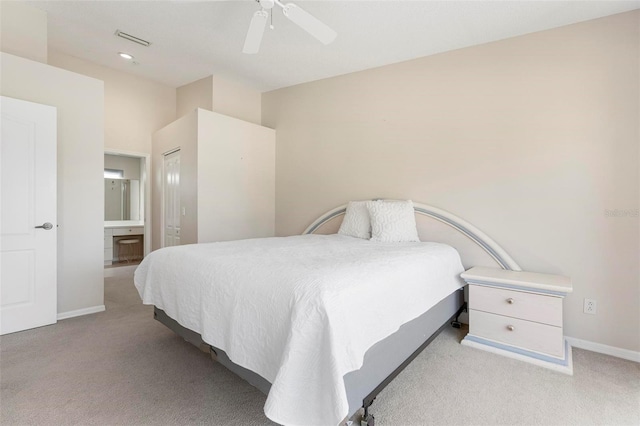 bedroom with visible vents, connected bathroom, baseboards, light carpet, and a ceiling fan