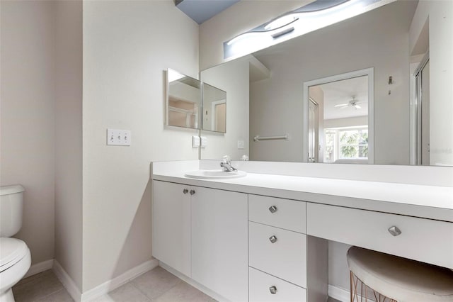 full bathroom featuring toilet, tile patterned flooring, baseboards, ceiling fan, and vanity