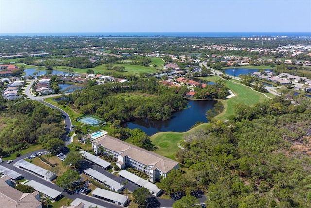 aerial view with view of golf course, a water view, and a residential view