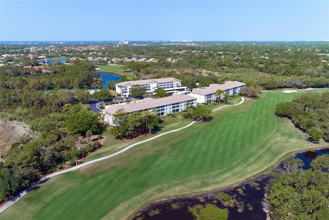 birds eye view of property featuring golf course view and a water view