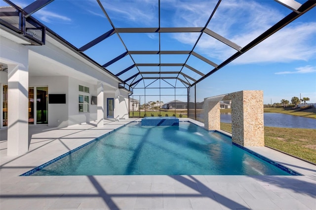 view of pool with a patio area, glass enclosure, a pool with connected hot tub, and a water view