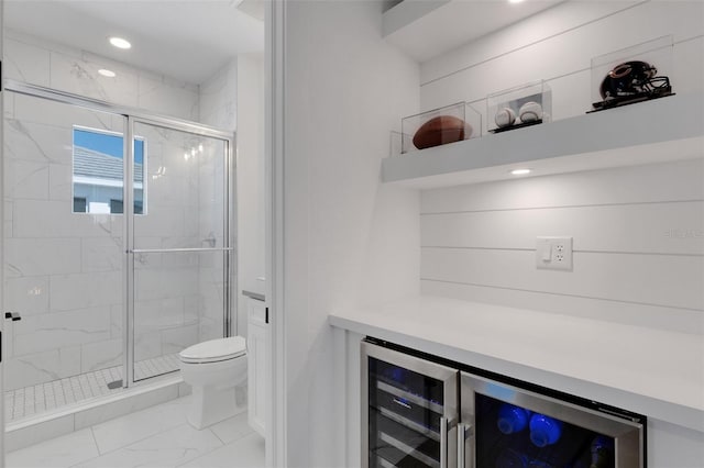 full bath featuring toilet, recessed lighting, marble finish floor, and a stall shower