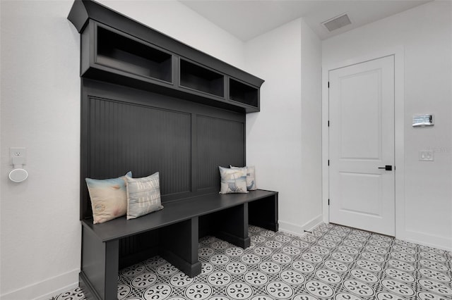 mudroom featuring light tile patterned floors, visible vents, and baseboards