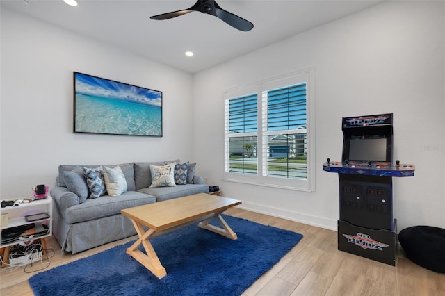 living room with recessed lighting, baseboards, ceiling fan, and wood finished floors